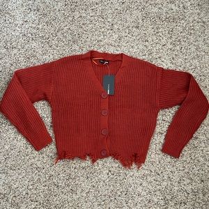 Fashionova rustic red distressed cropped cardigan sweater.